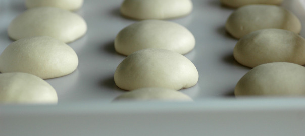 Pizza dough in a dough tray